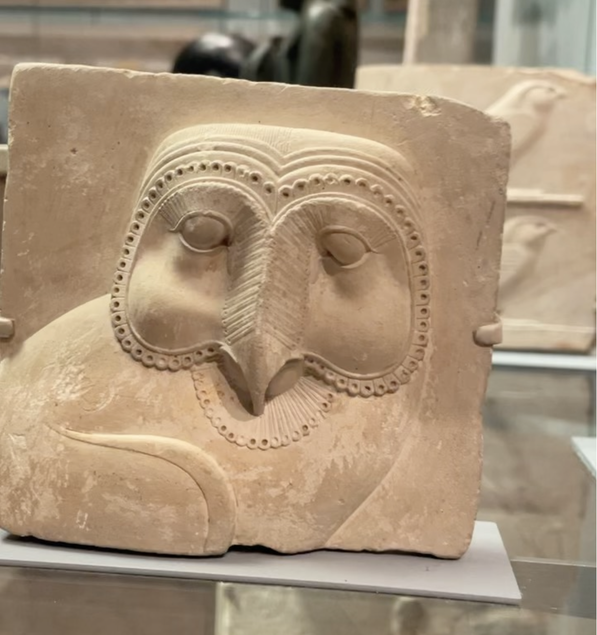 Relief plaque with face of an owl hieroglyph