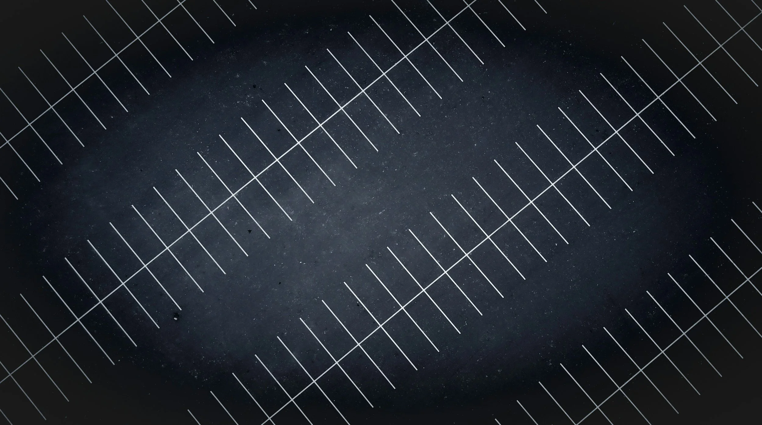 Close-up of a parking lot the dark surface with white lines of the grid pattern.