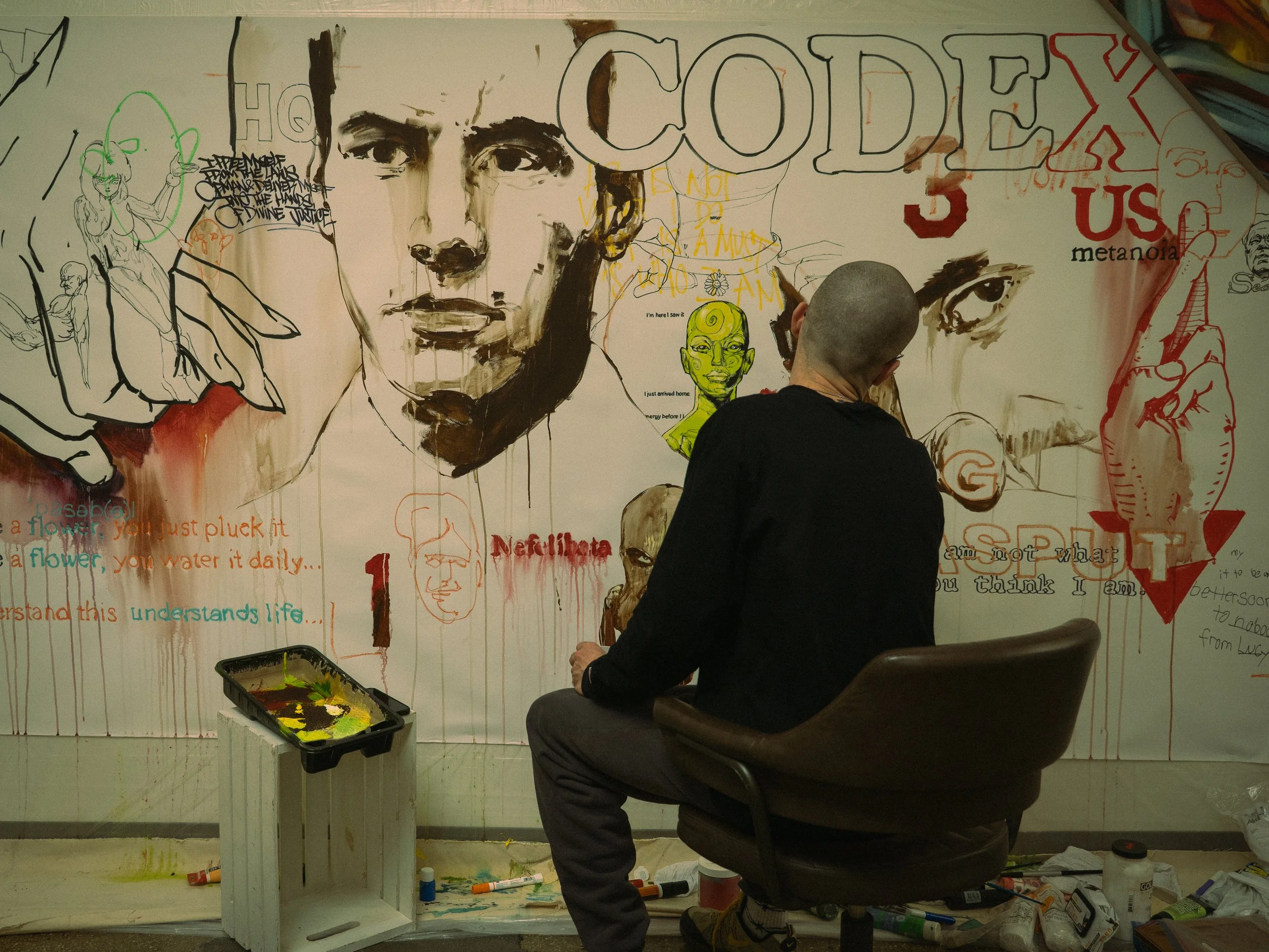 At Project 14C in Jersey City, an artist works on his latest piece for exhibition
