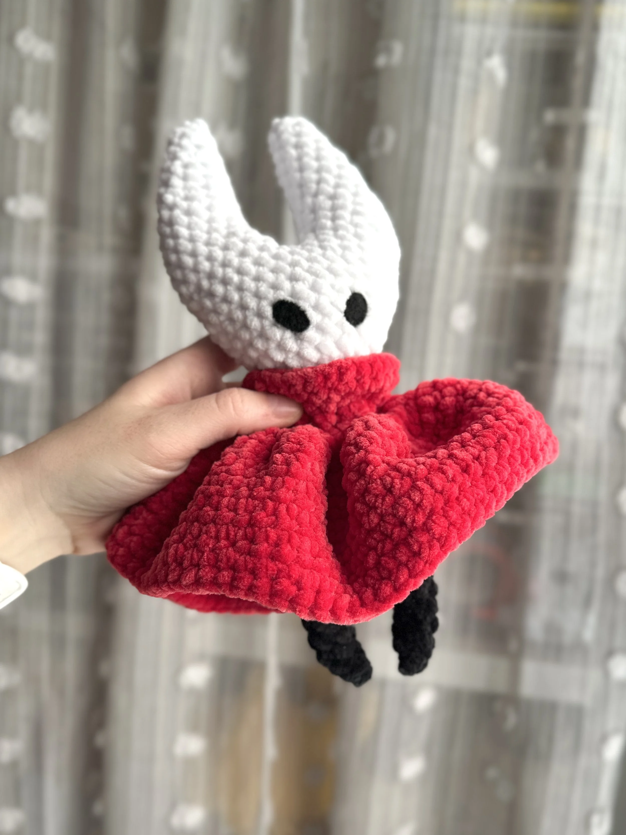 crochet bug warrior with red cape