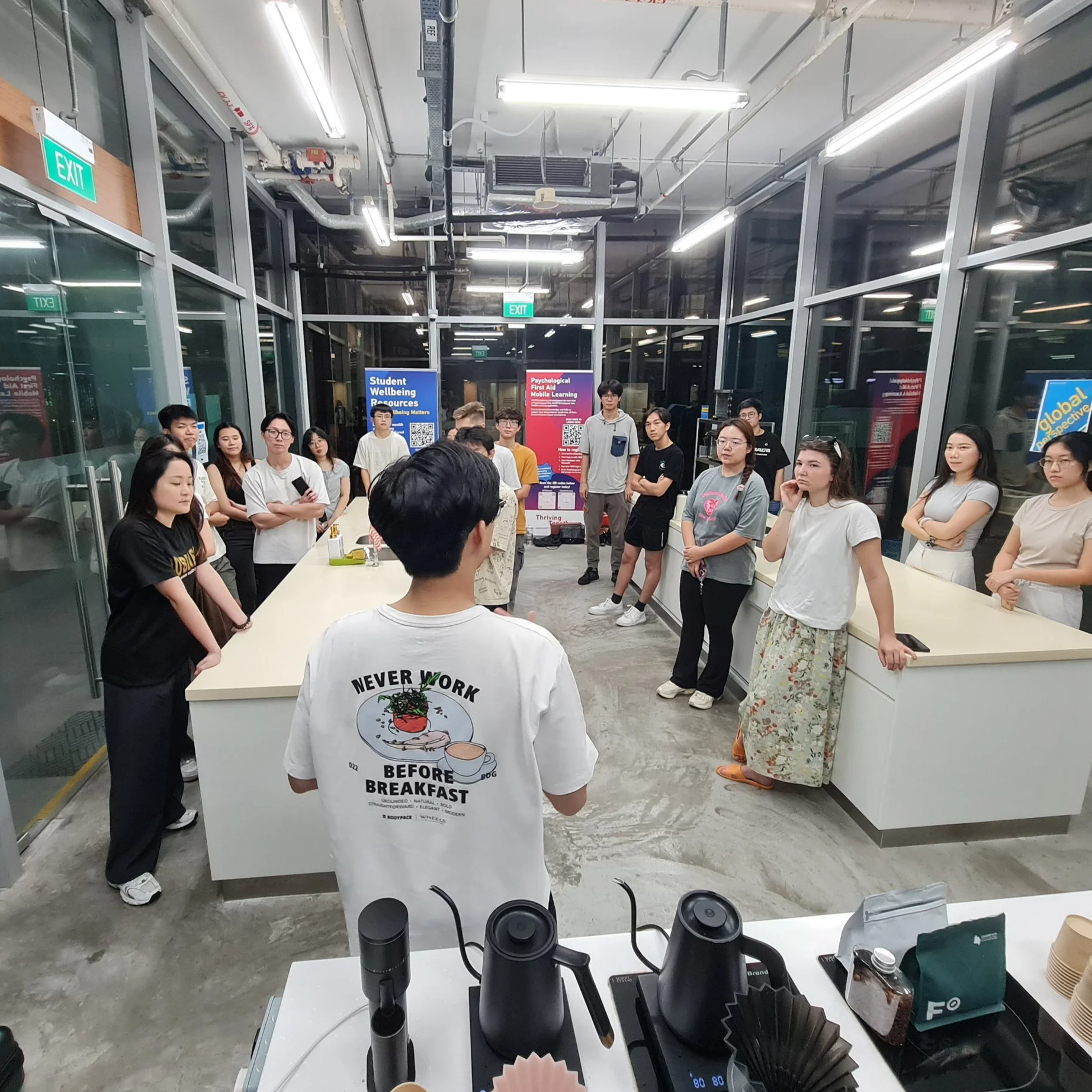 Corporate team engaged in an interactive specialty coffee workshop led by Simple Brewings.