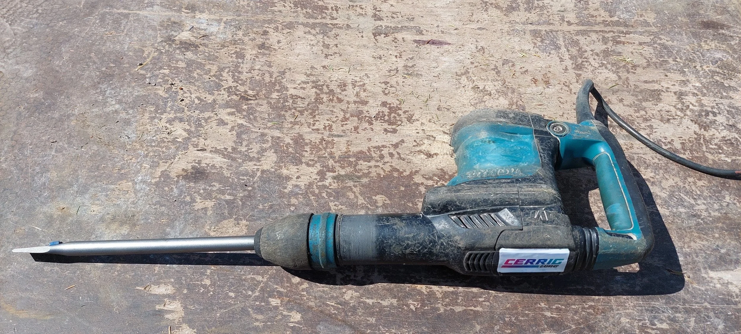 Power drill on a rough wooden surface