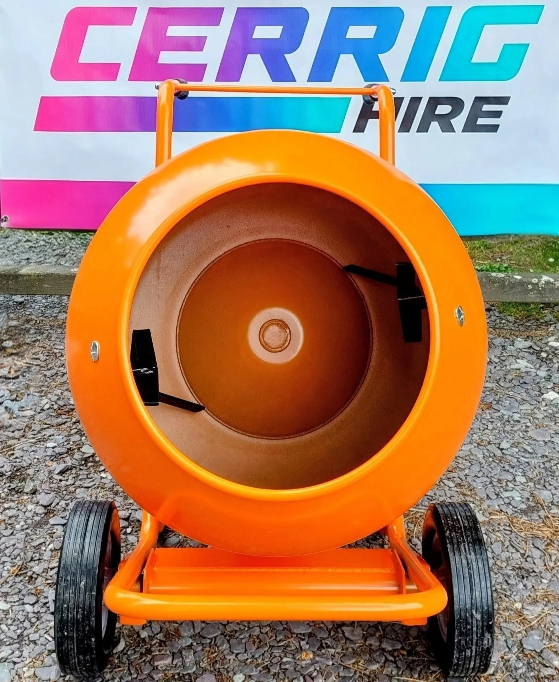 a cement mixer with a large orange drum and black wheels.