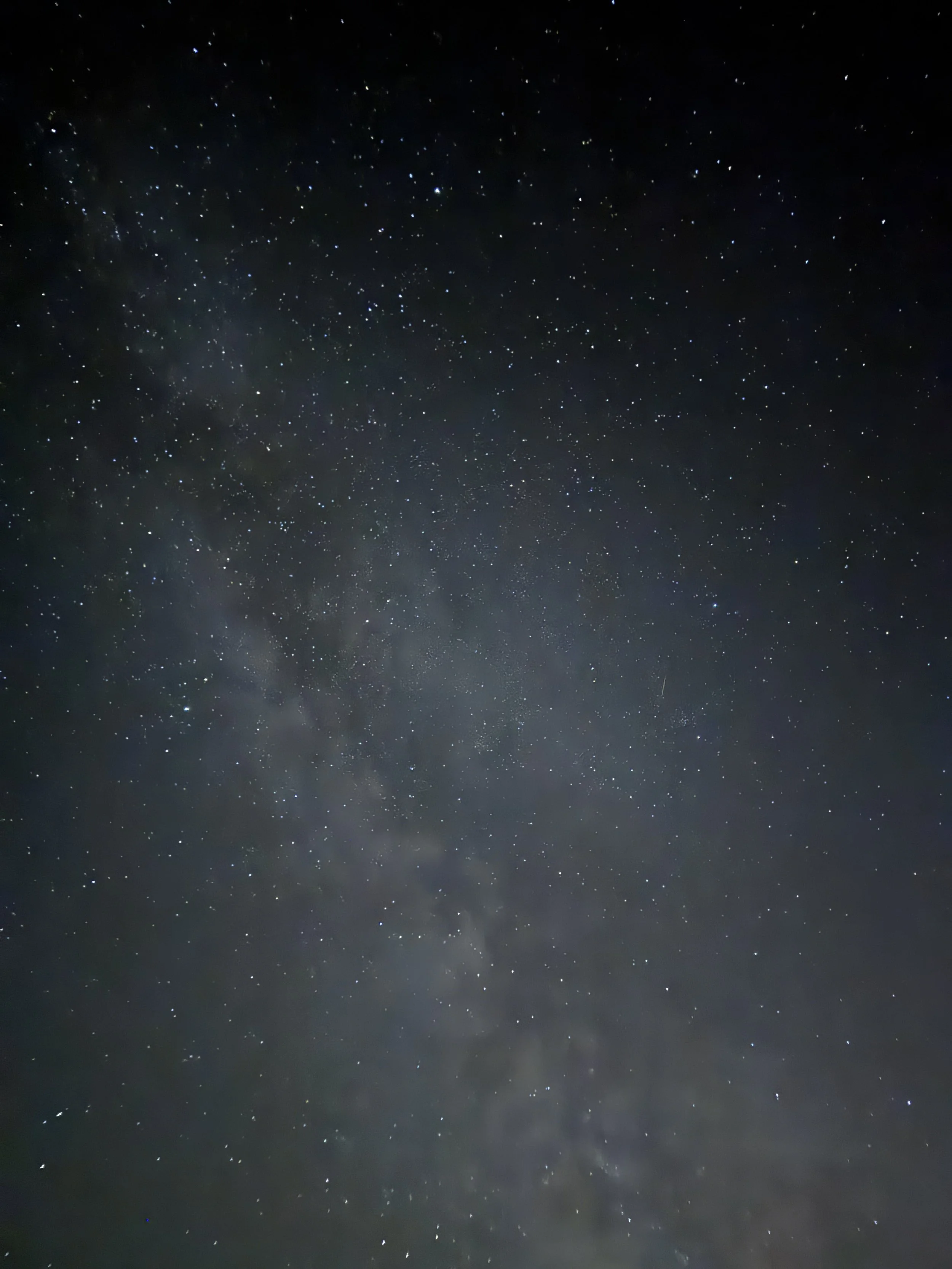 Night sky filled with stars, some forming constellations or patterns.