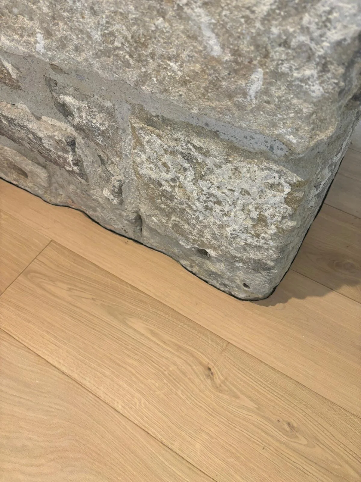 An unfinished lacquered wood floor
