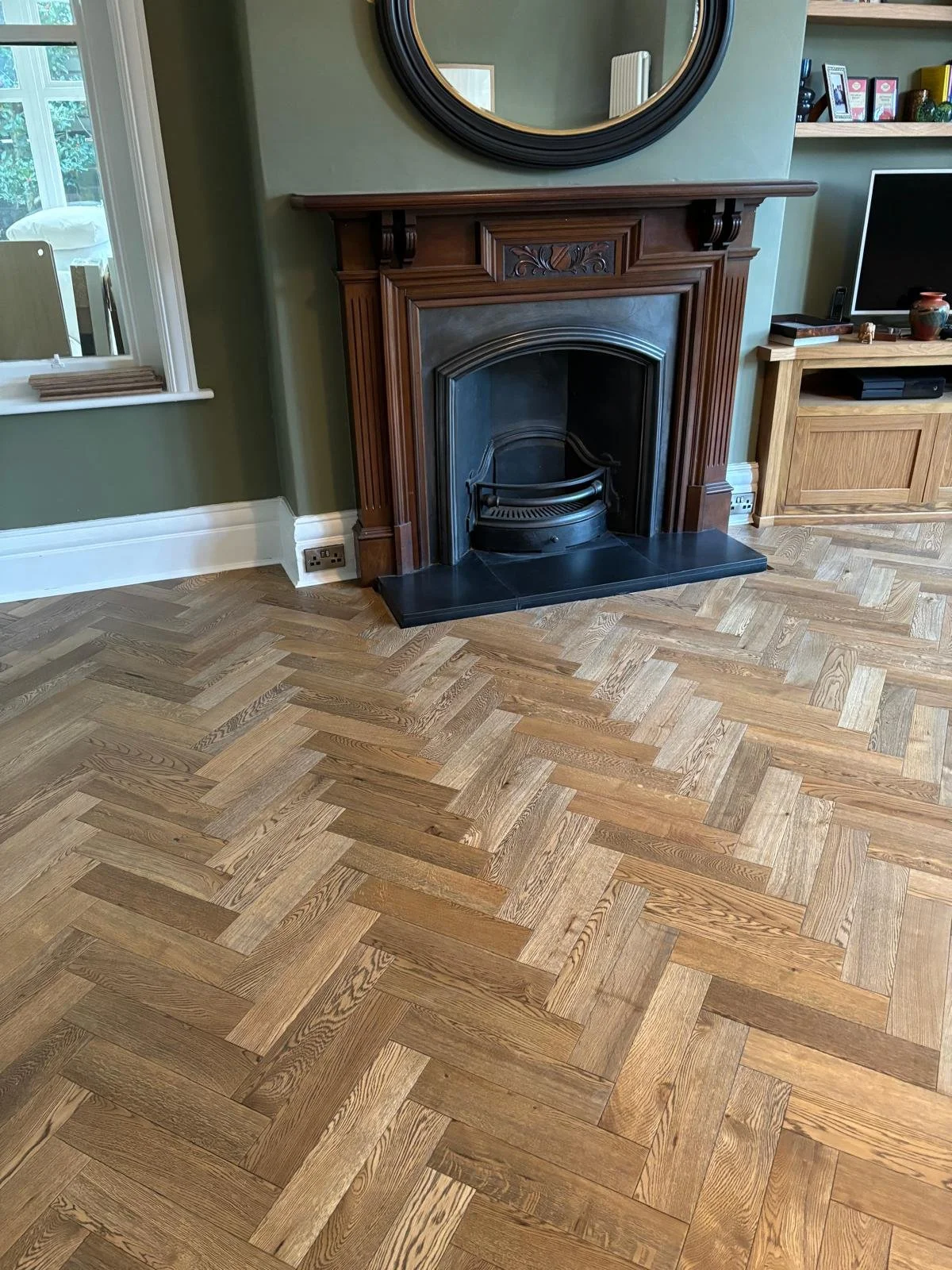 a rich brown herringbone wood floor