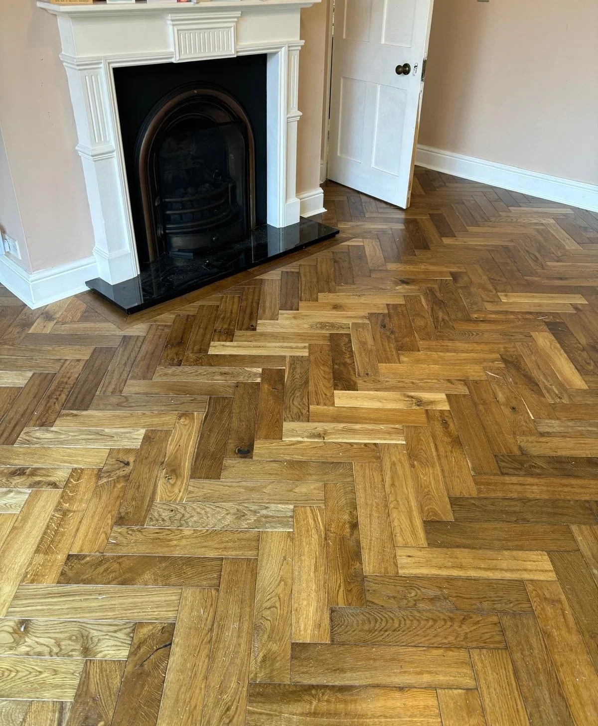 a brown herringbone floor