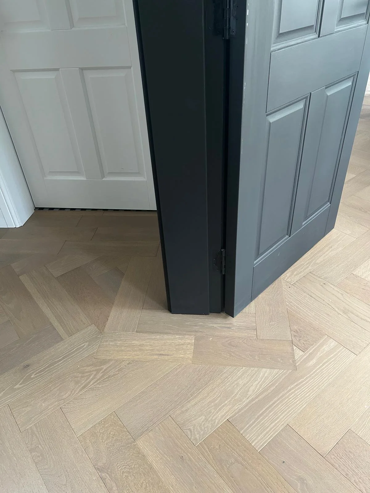 a herringbone floor with a plank border