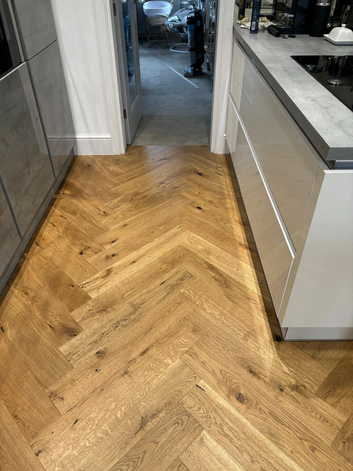 A natural rustic herringbone floor
