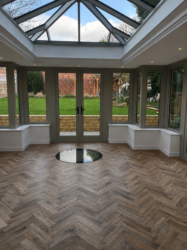 a rustic brown herringbone floor
