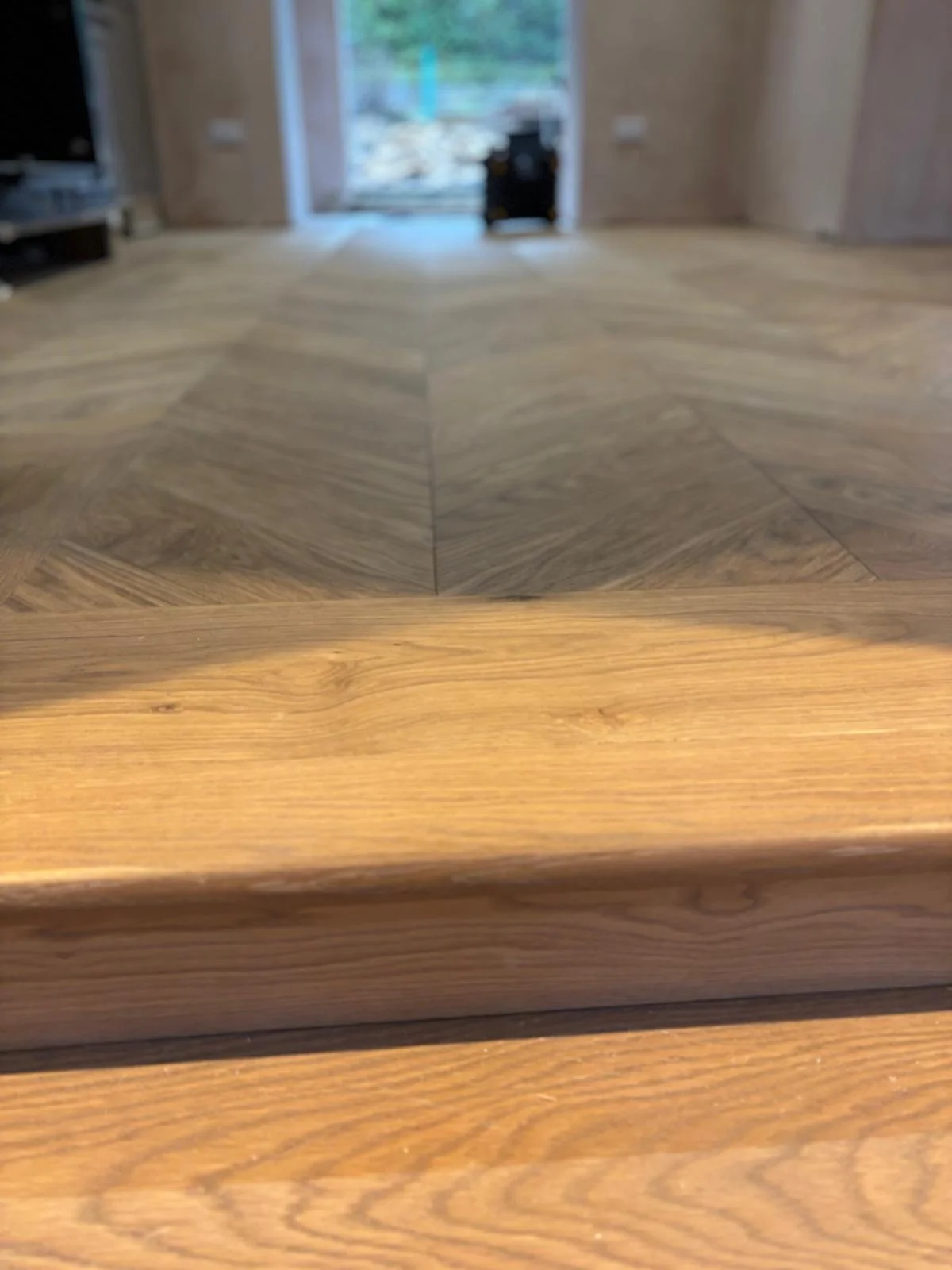 a stair nosing and wood floor