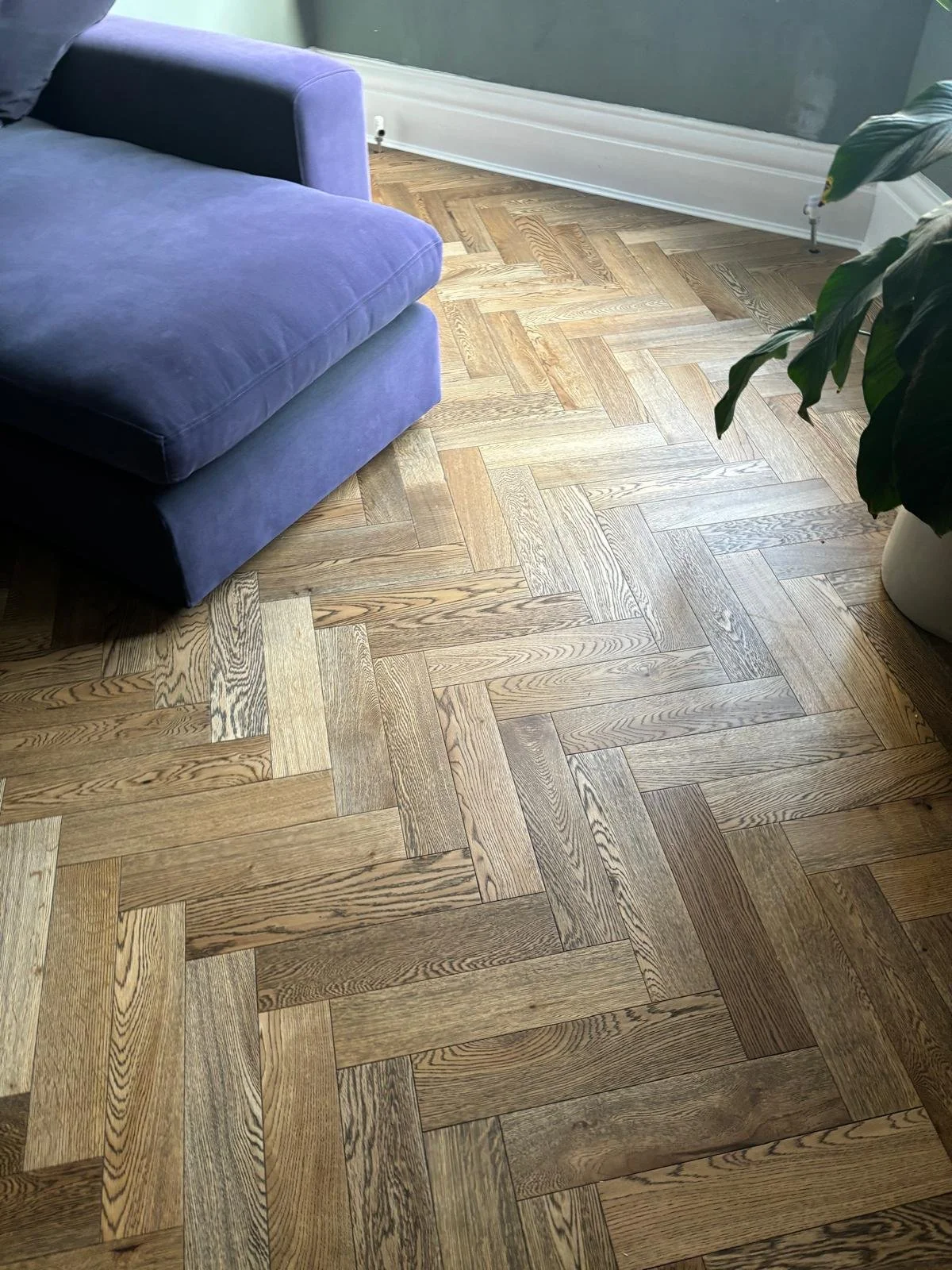 a rich dark wood herringbone floor