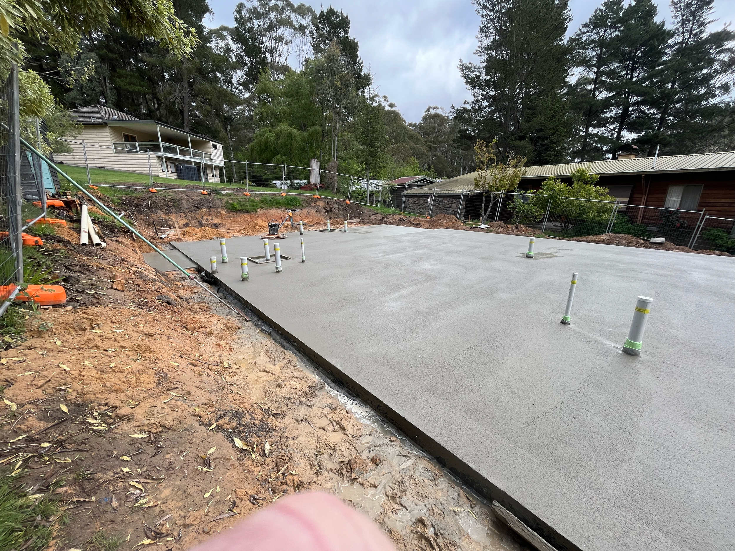 New concrete slab poured for the Alpine kit home on a sloping block near Mansfield