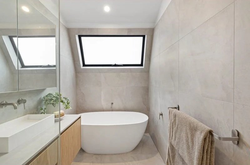 Ensuite with freestanding bath under a skylight, Bentleigh townhouse