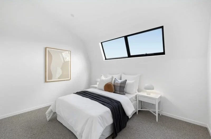 Bedroom with raked ceiling and highlight window, Bentleigh townhouse