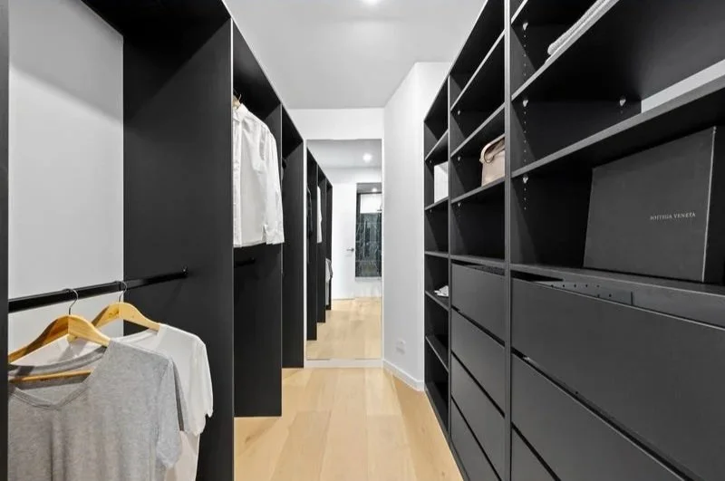 Walk-in robe with black open shelving, Bentleigh townhouse