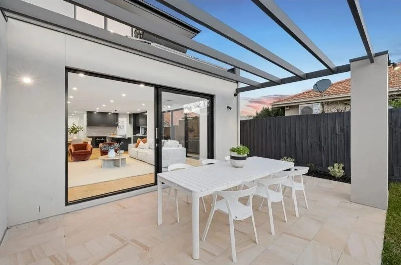 Alfresco dining under a pergola off the living area, Bentleigh townhouse