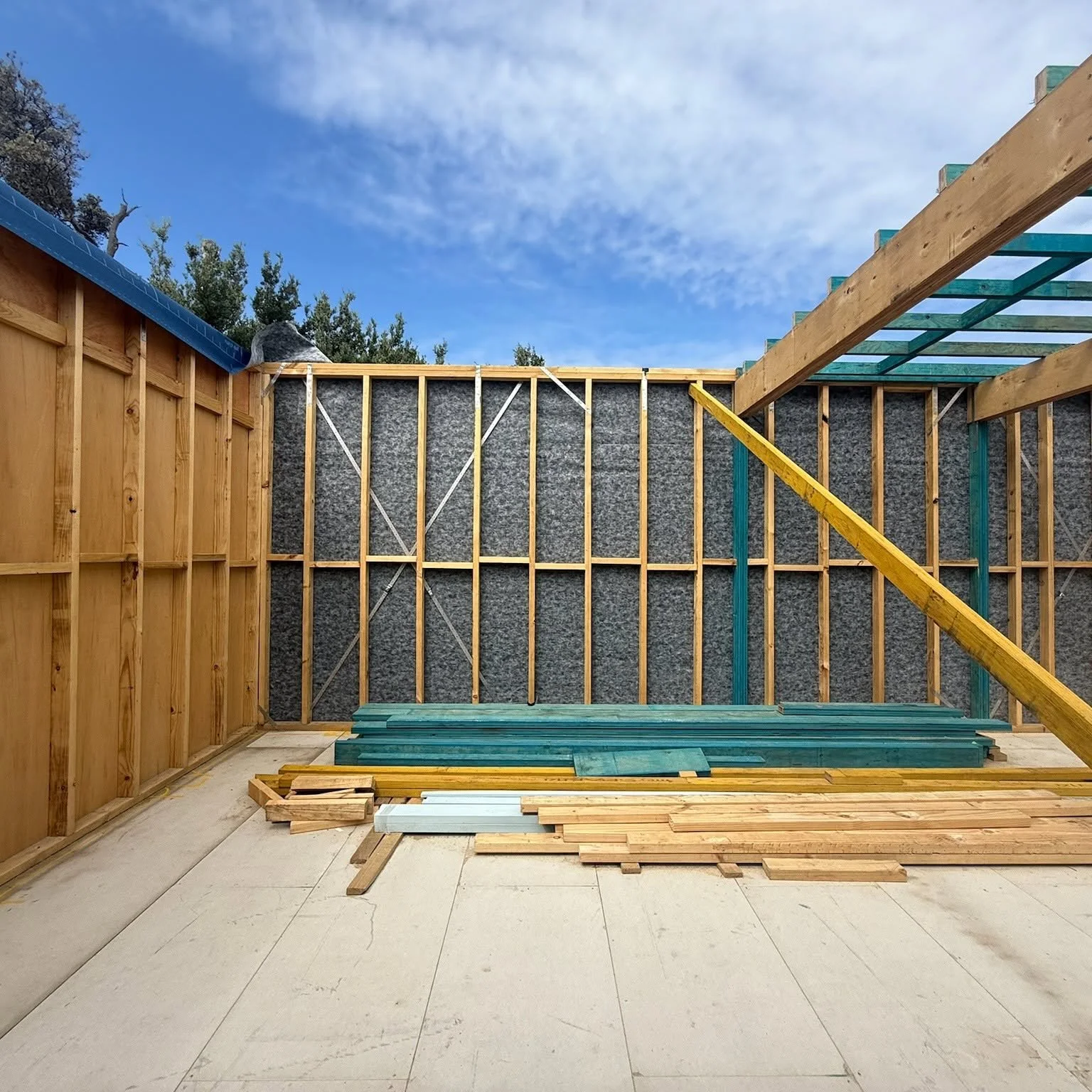 Wall frames and insulation, beach boatshed rebuild