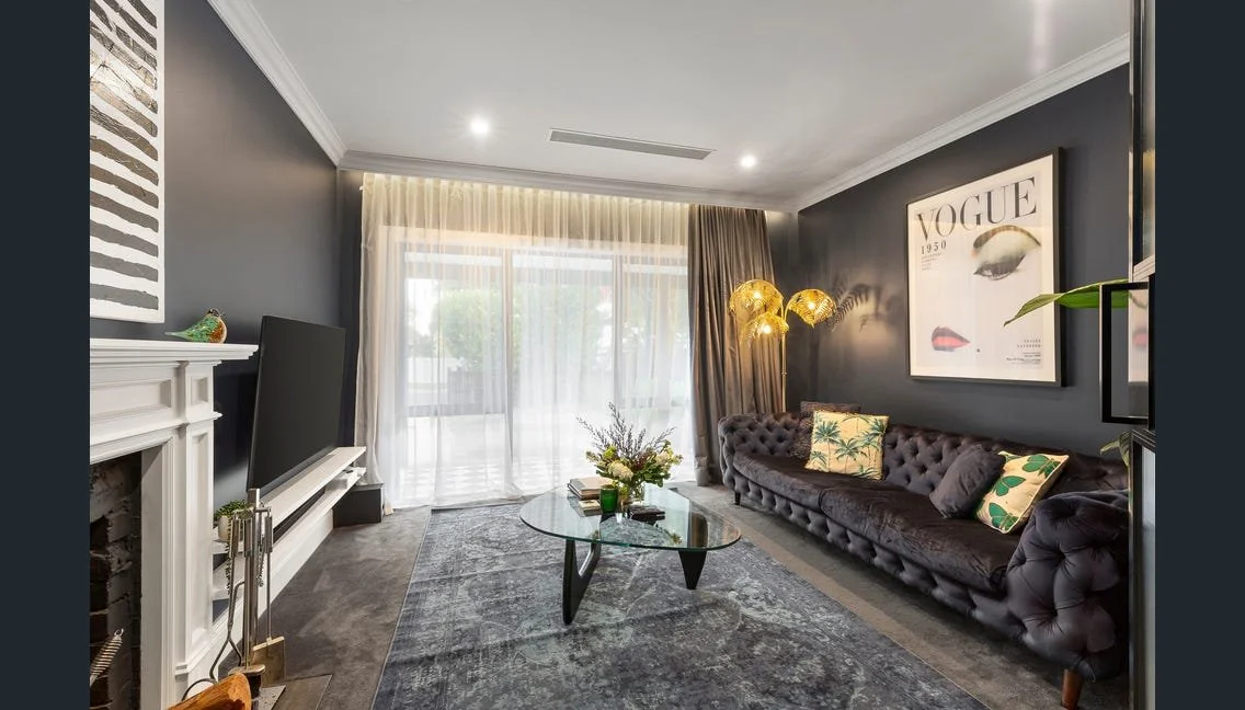 Front lounge with velvet sofa and dark feature wall, Highett renovation