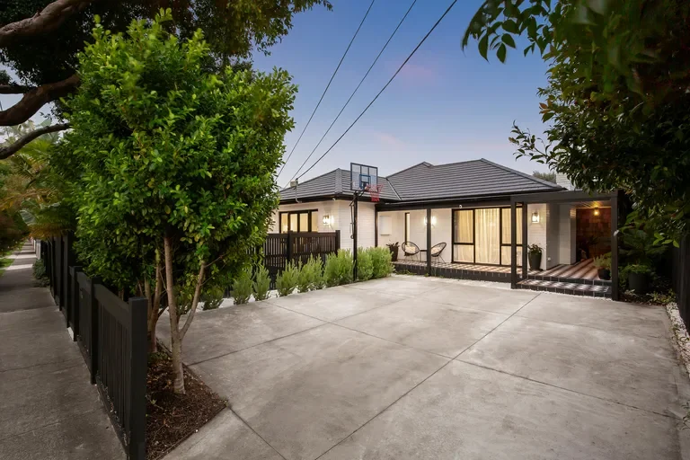 Rear of the renovated Highett home and concrete driveway