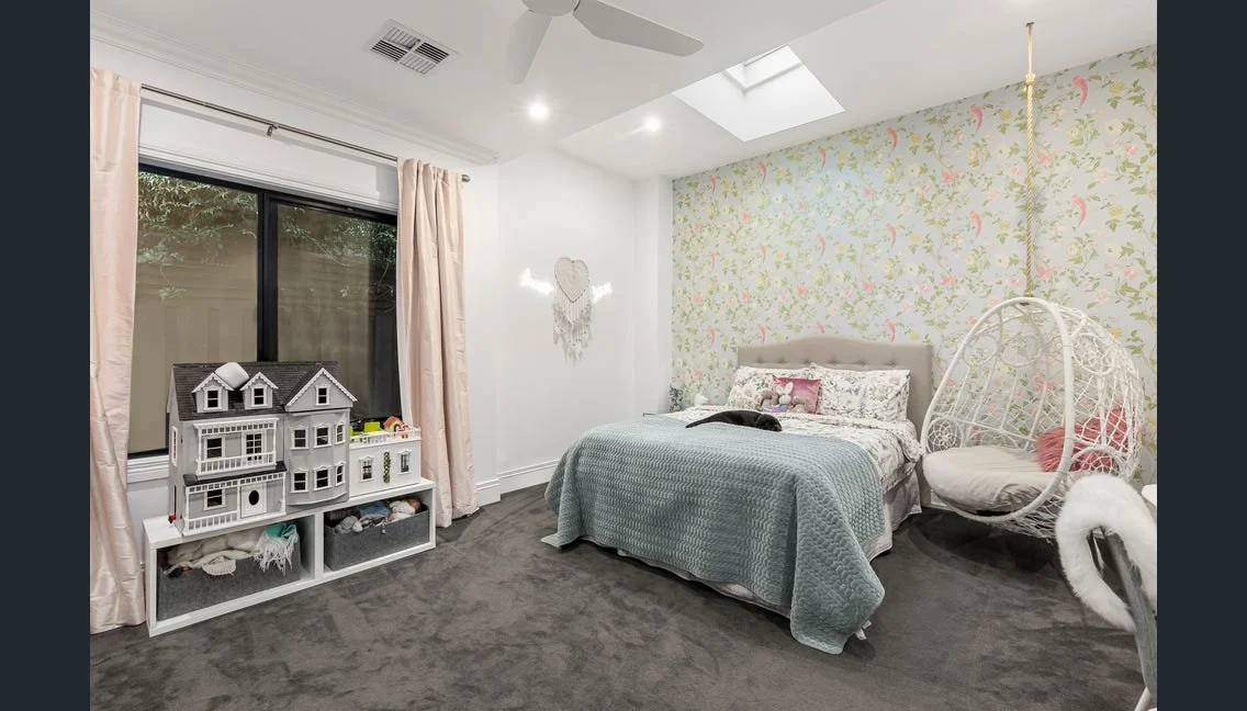 Child’s bedroom with skylight and floral wallpaper, Highett renovation