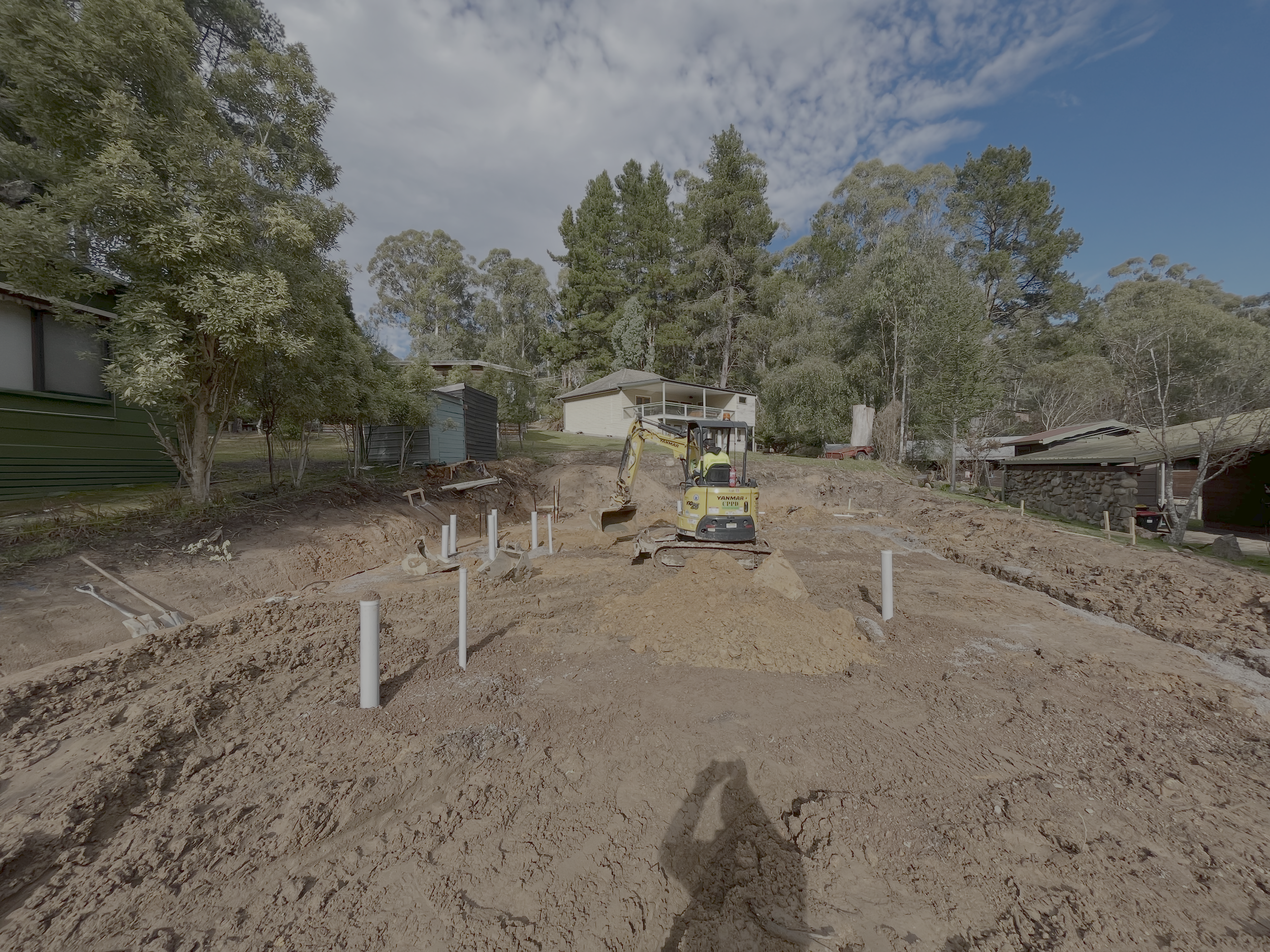 Plumbing set-out on the levelled pad before the slab pour for the Mansfield Alpine build