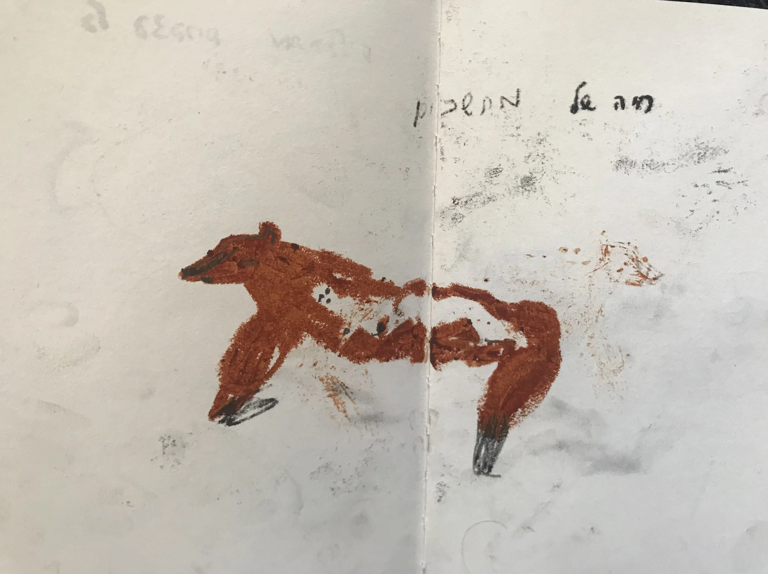 A child’s drawing of a brown horse on white paper, with a handwritten note above it.