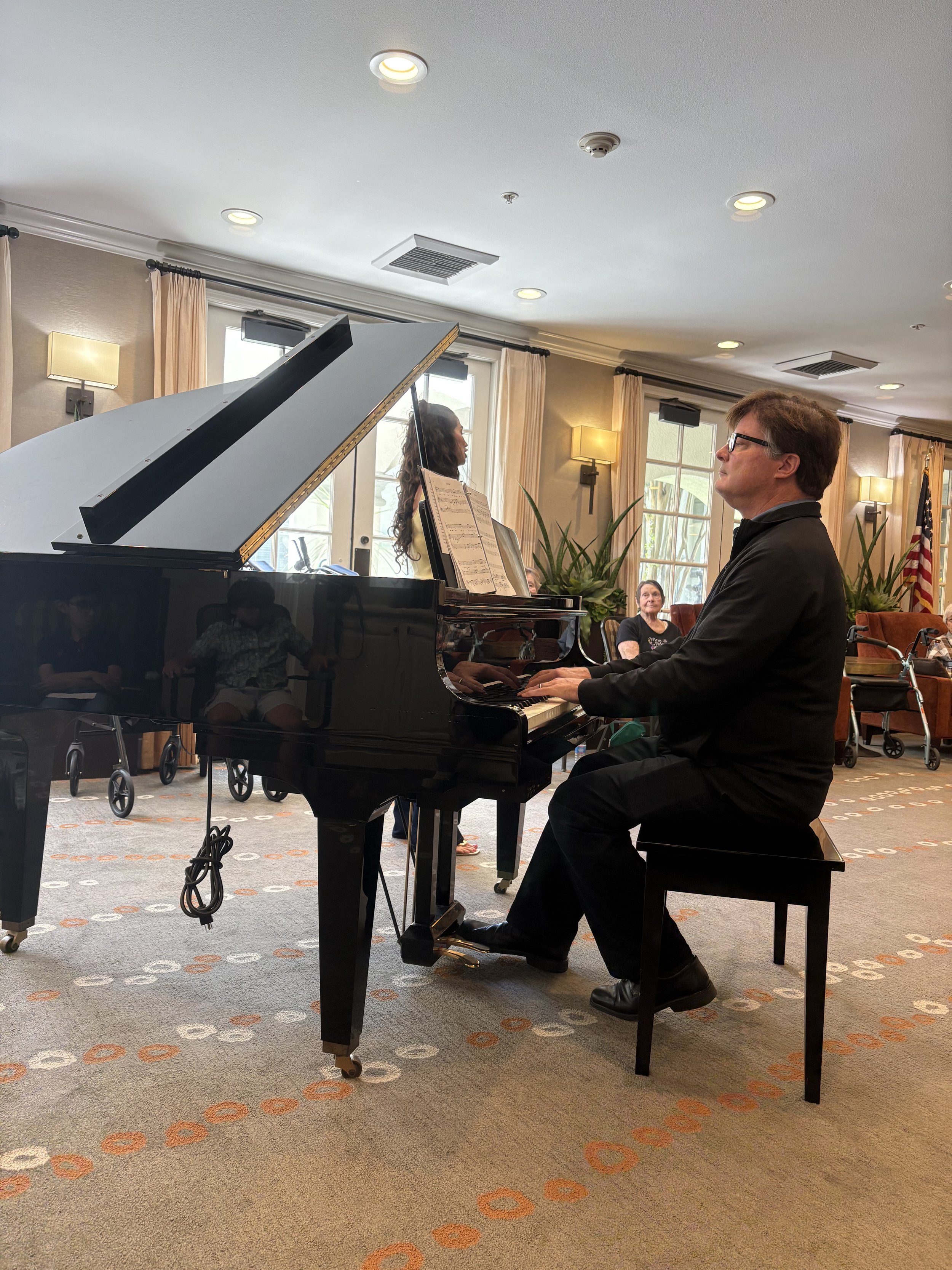 Dennis Frayne Playing Piano at Concert Performance Team Recital