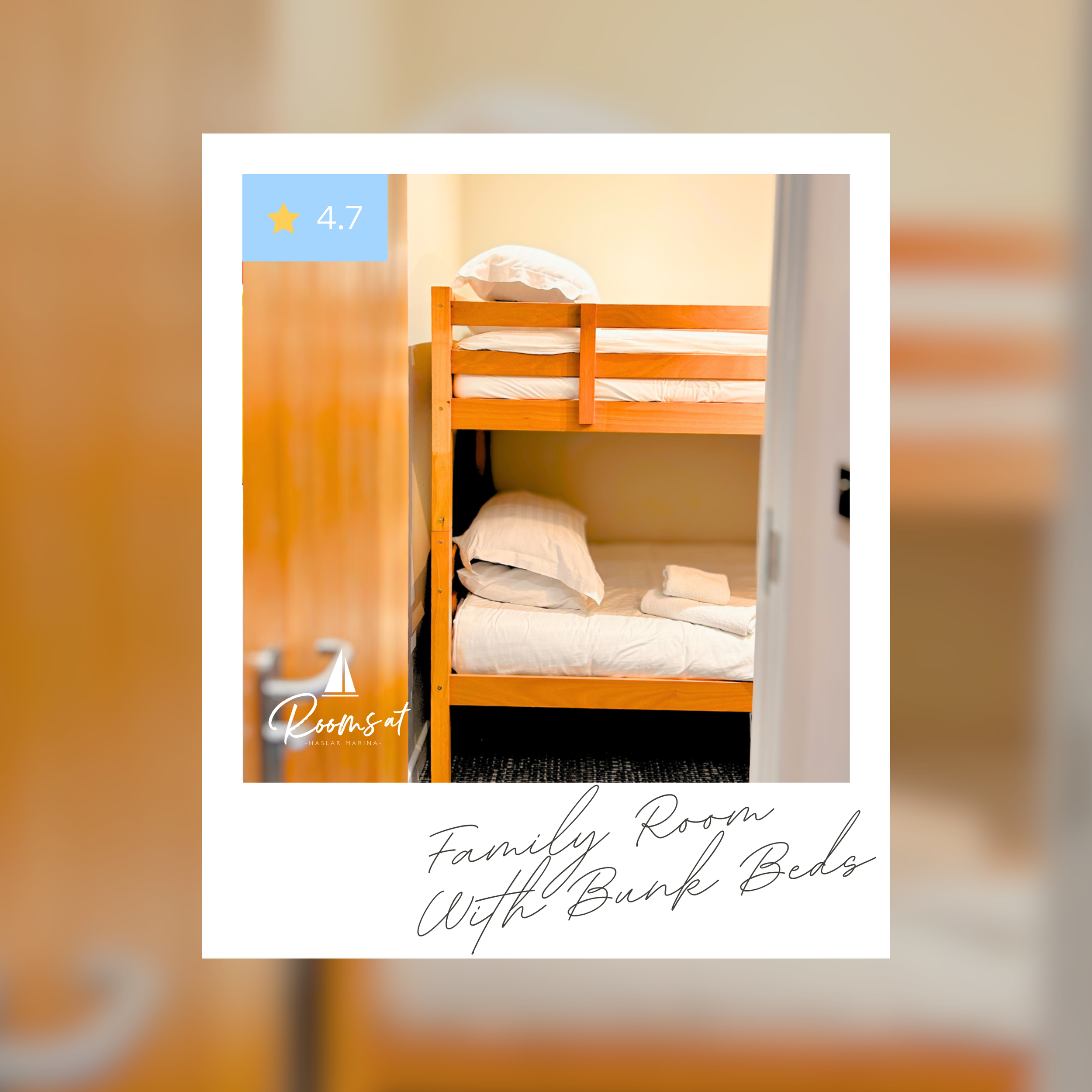 View of a wooden bunk bed with two mattresses, pillows, and linen in a cozy bedroom setting, with a beige wall in the background.