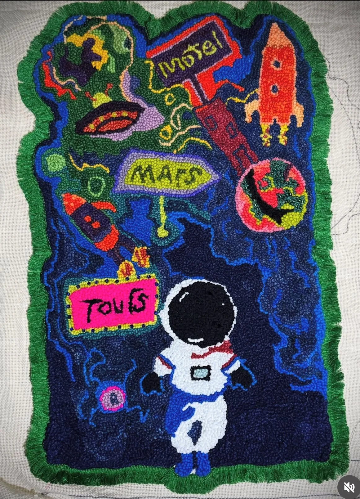 A colorful artwork featuring a space-themed scene with an astronaut, planets, rockets, and words like 'Mars' and 'Taurus.'