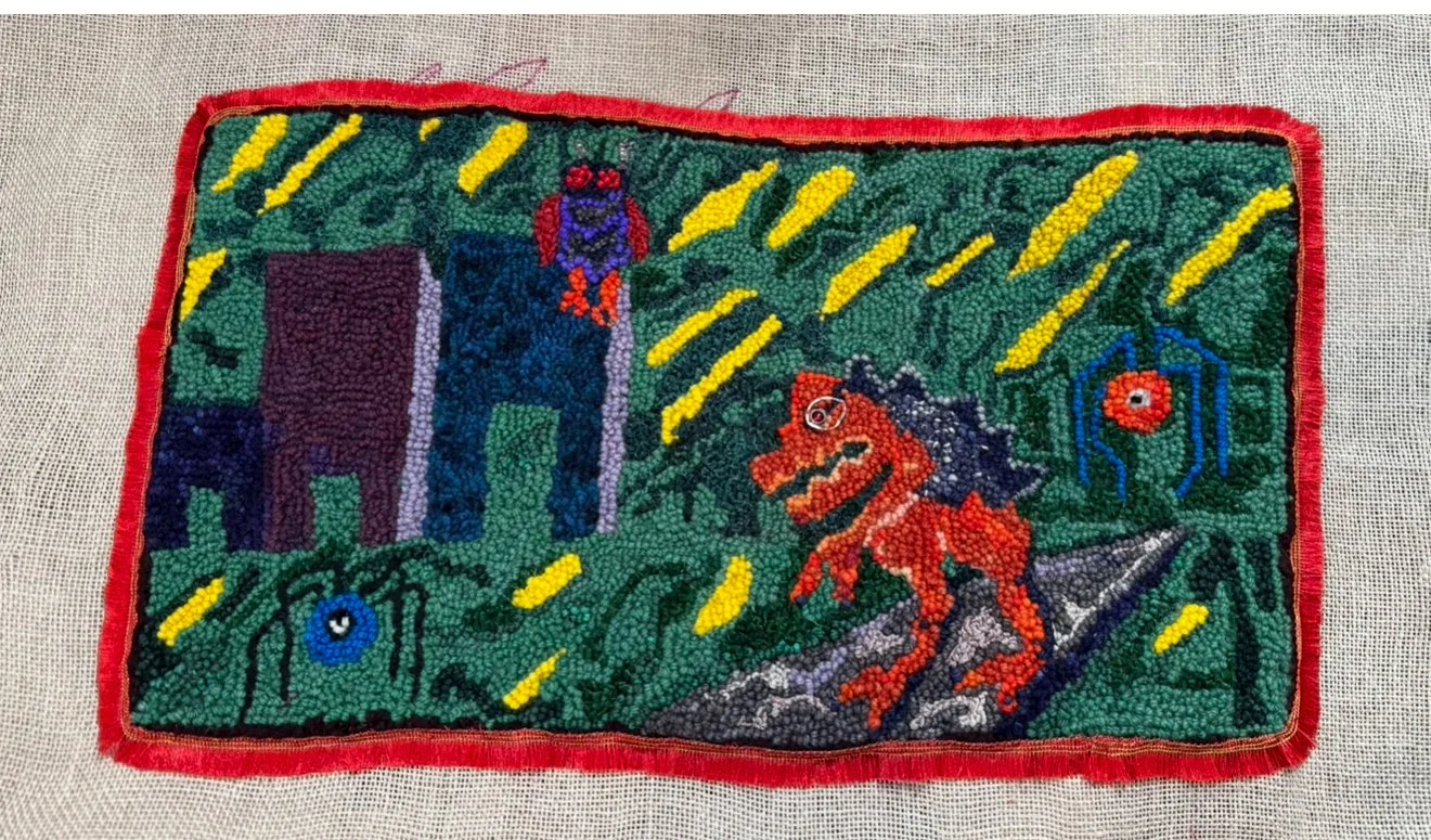 Colorful rug featuring a dinosaur, buildings, and spider symbols with a red border.