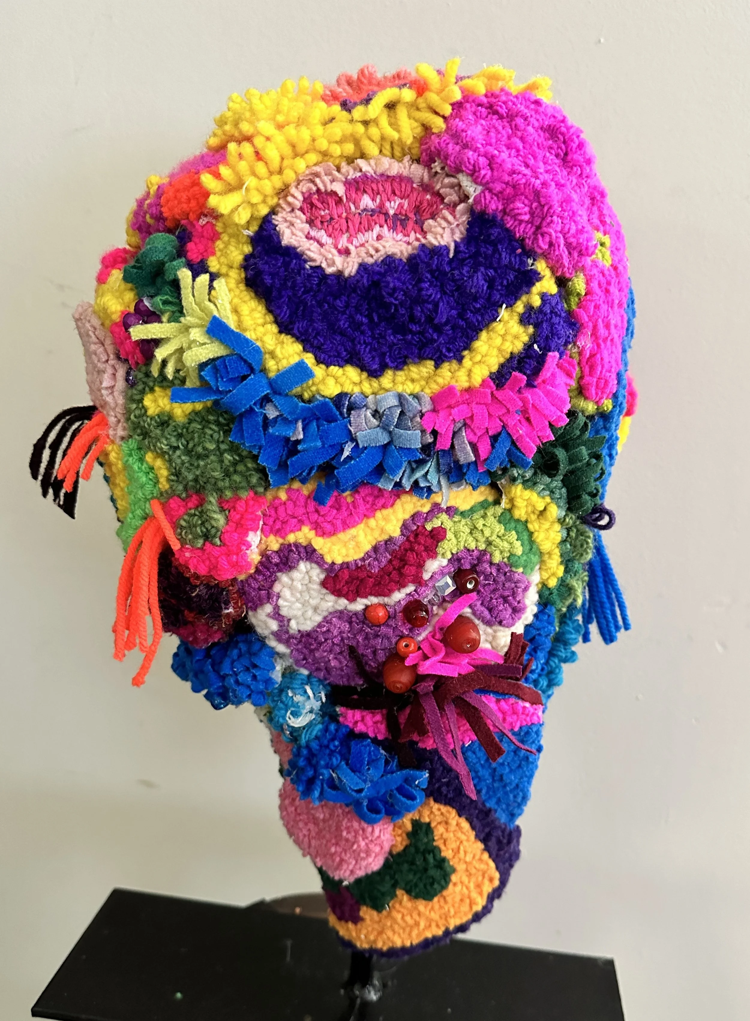 Colorful abstract self  portrait made with wool