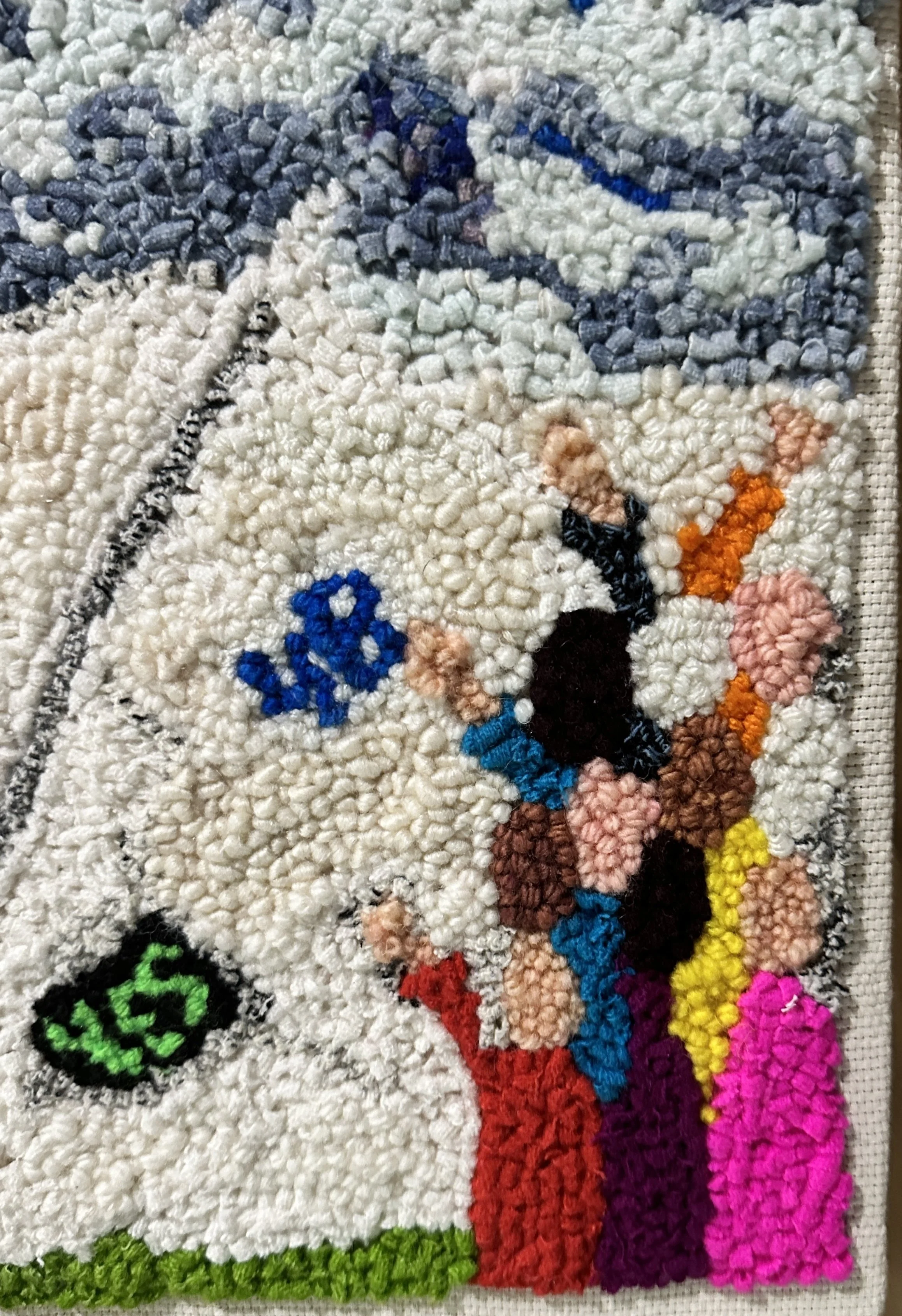 Close-up of a colorful, wool rugart piece featuring several vibrant colors and patterns, including a green peace symbol, multicolored sections, and abstract designs.