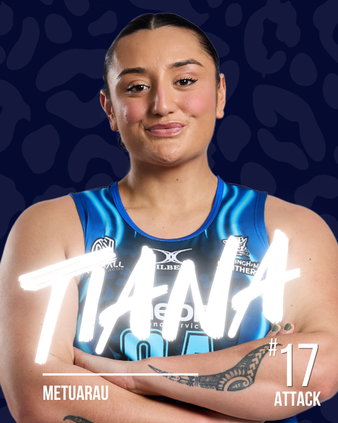 A netball player in a blue netball dress with arms crossed, standing against a dark patterned background, with glowing white text saying 'TANA' and additional text with her team name 'METUARAU', and her number 17 with the position 'ATTACK'.