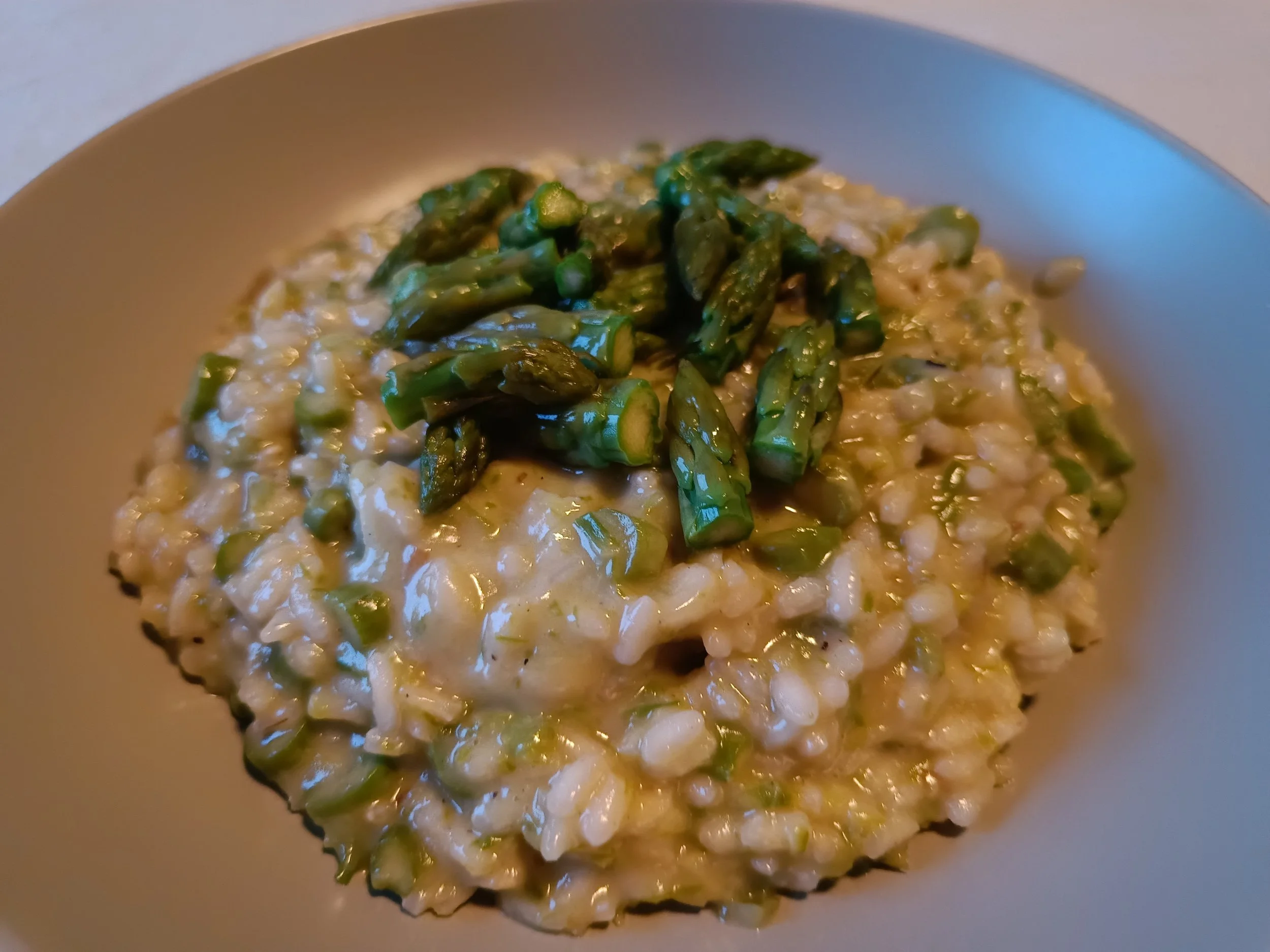 Creamy asparagus risotto served in a bowl.