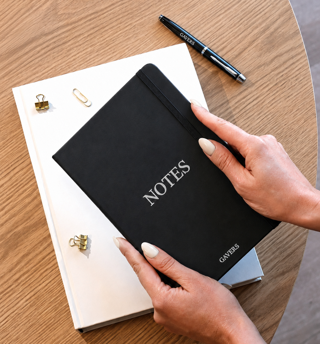 Hands with notebook.png