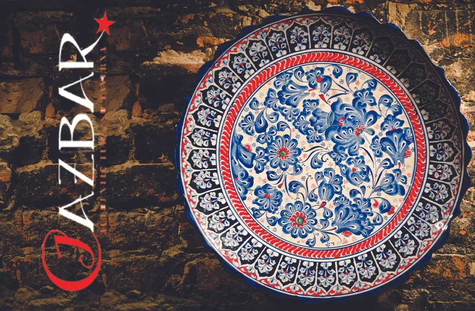 Cazbar logo beside a colorful Turkish ceramic plate