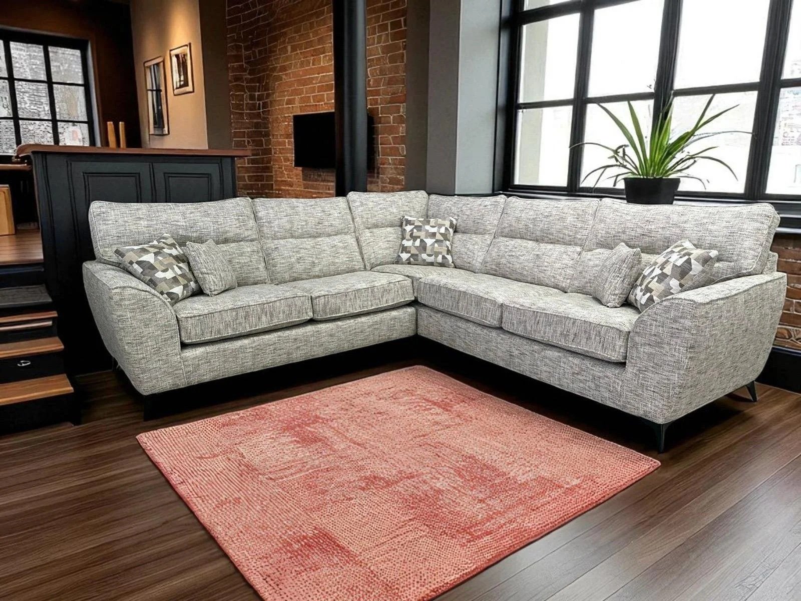 A contemporary sofa featuring beautiful new fabric ranges of super smooth tactile fabric through to luxurious chenille's, mixing bold colours with geometric accents. The streamlined design, finished with angular polished metal or wooden legs will sui