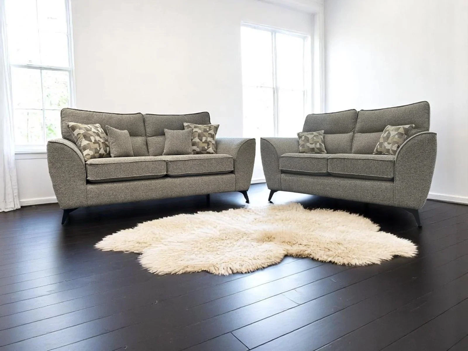 A contemporary sofa featuring beautiful new fabric ranges of super smooth tactile fabric through to luxurious chenille's, mixing bold colours with geometric accents. The streamlined design, finished with angular polished metal or wooden legs will sui