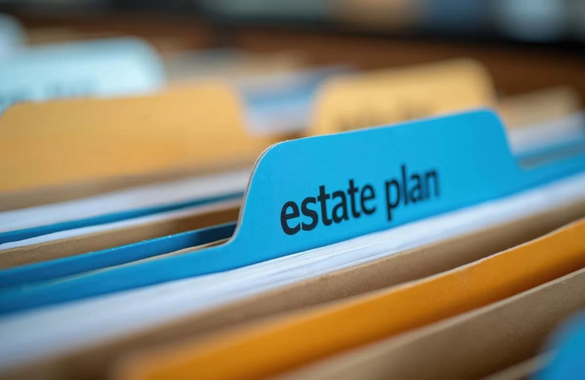 File folder labeled 'estate plan' in an organized filing system.