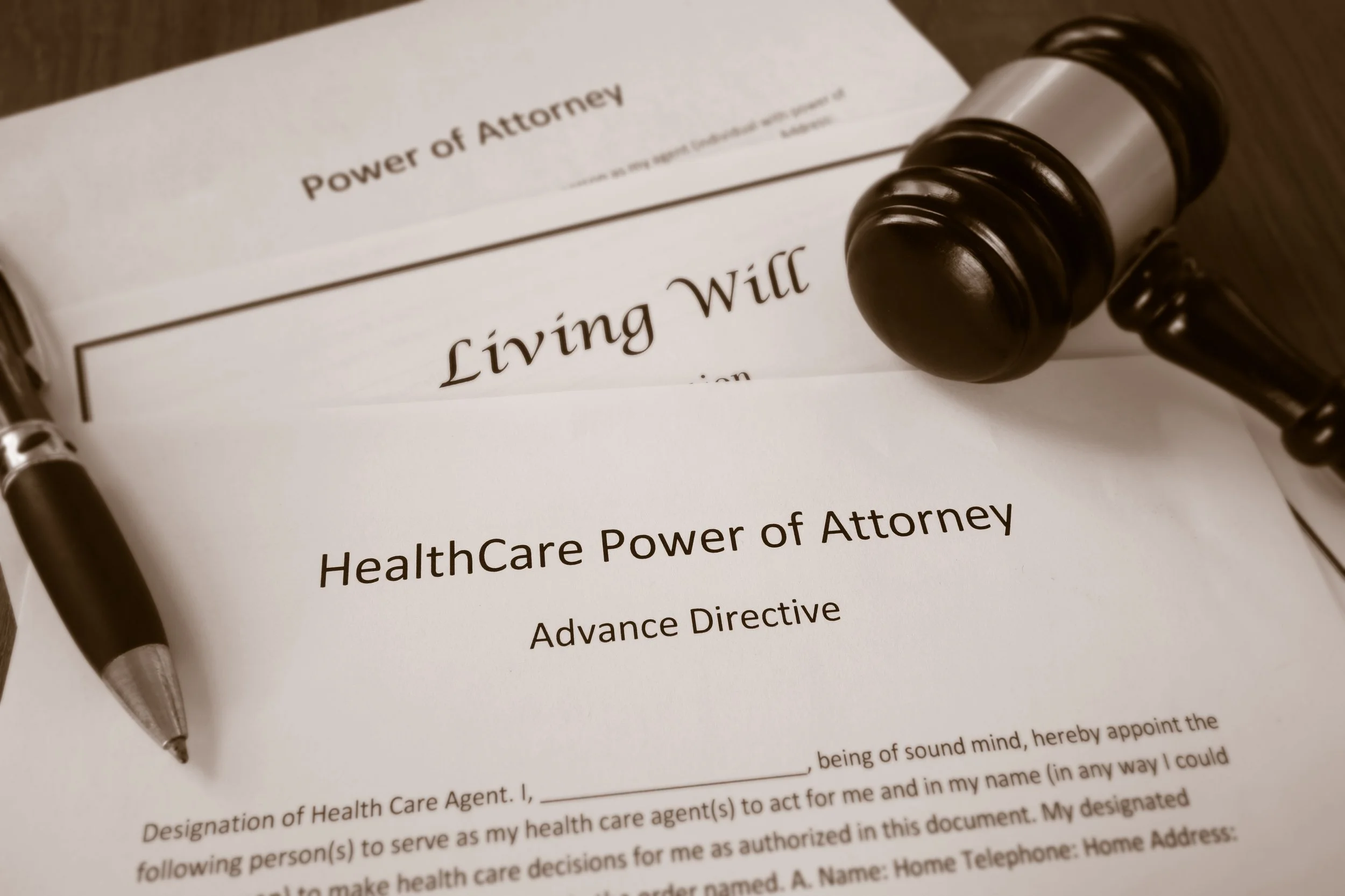 Legal document titled 'Power of Attorney' with a pen resting on top of it.