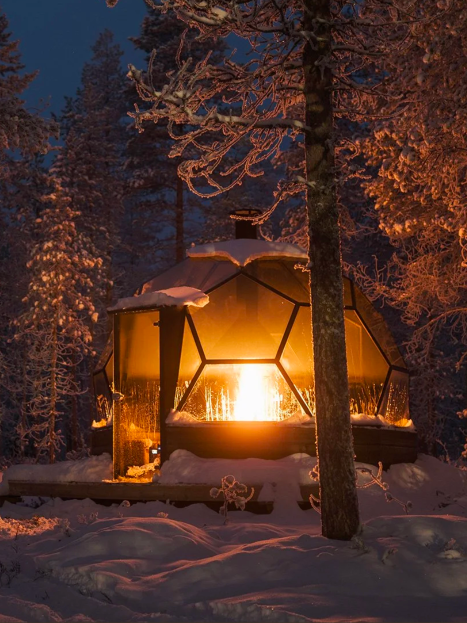Lit glass igloo at night