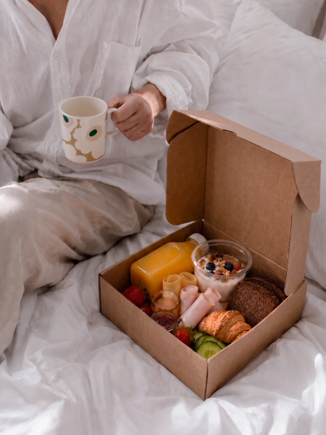 Woman eating a granola bowl with cloudberries