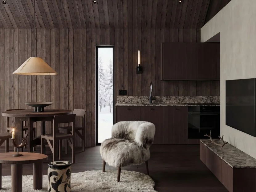 Dining table for four next to a floor-to-ceiling window facing snow-covered trees.