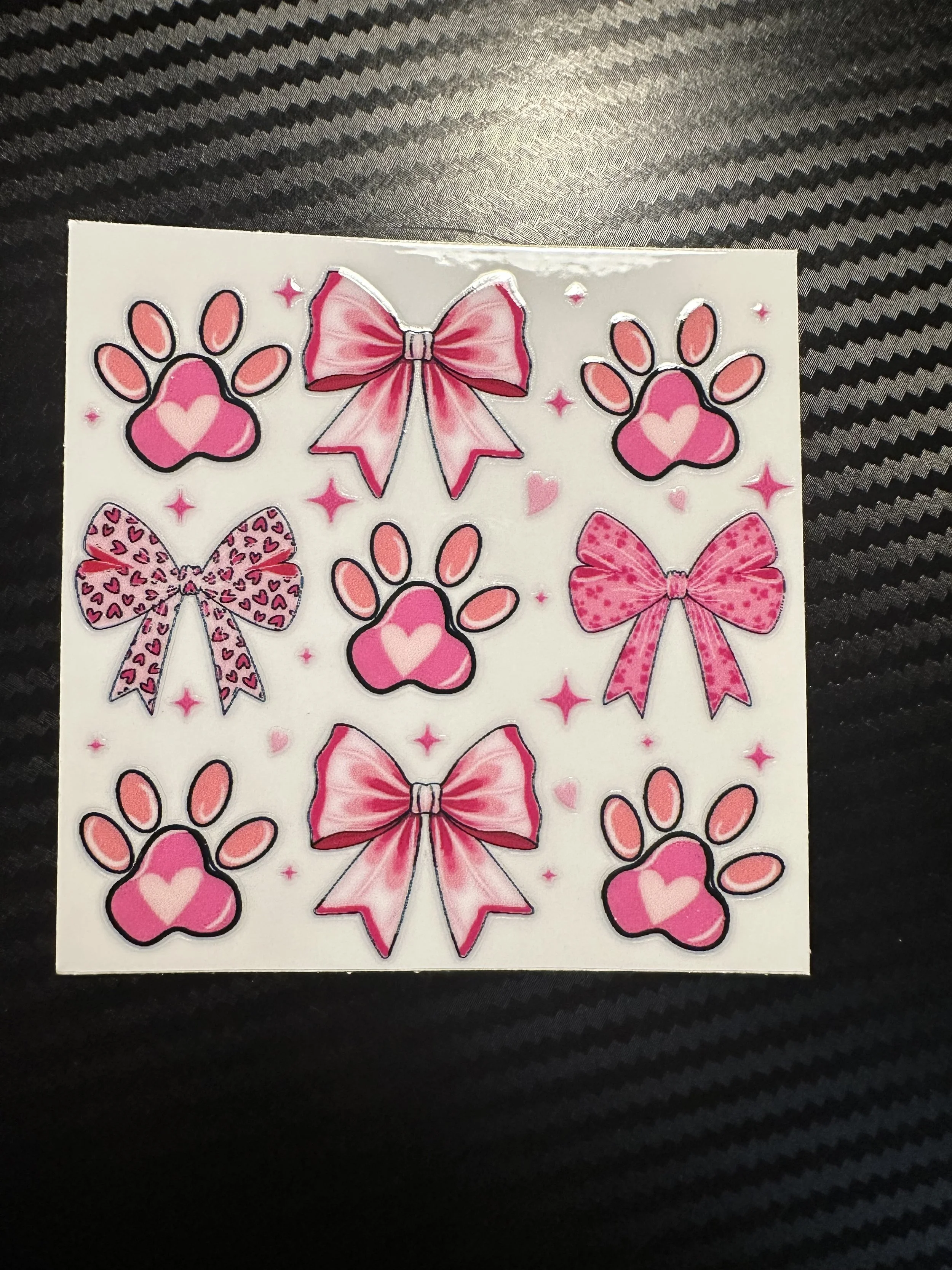 Pink bow and paw prints