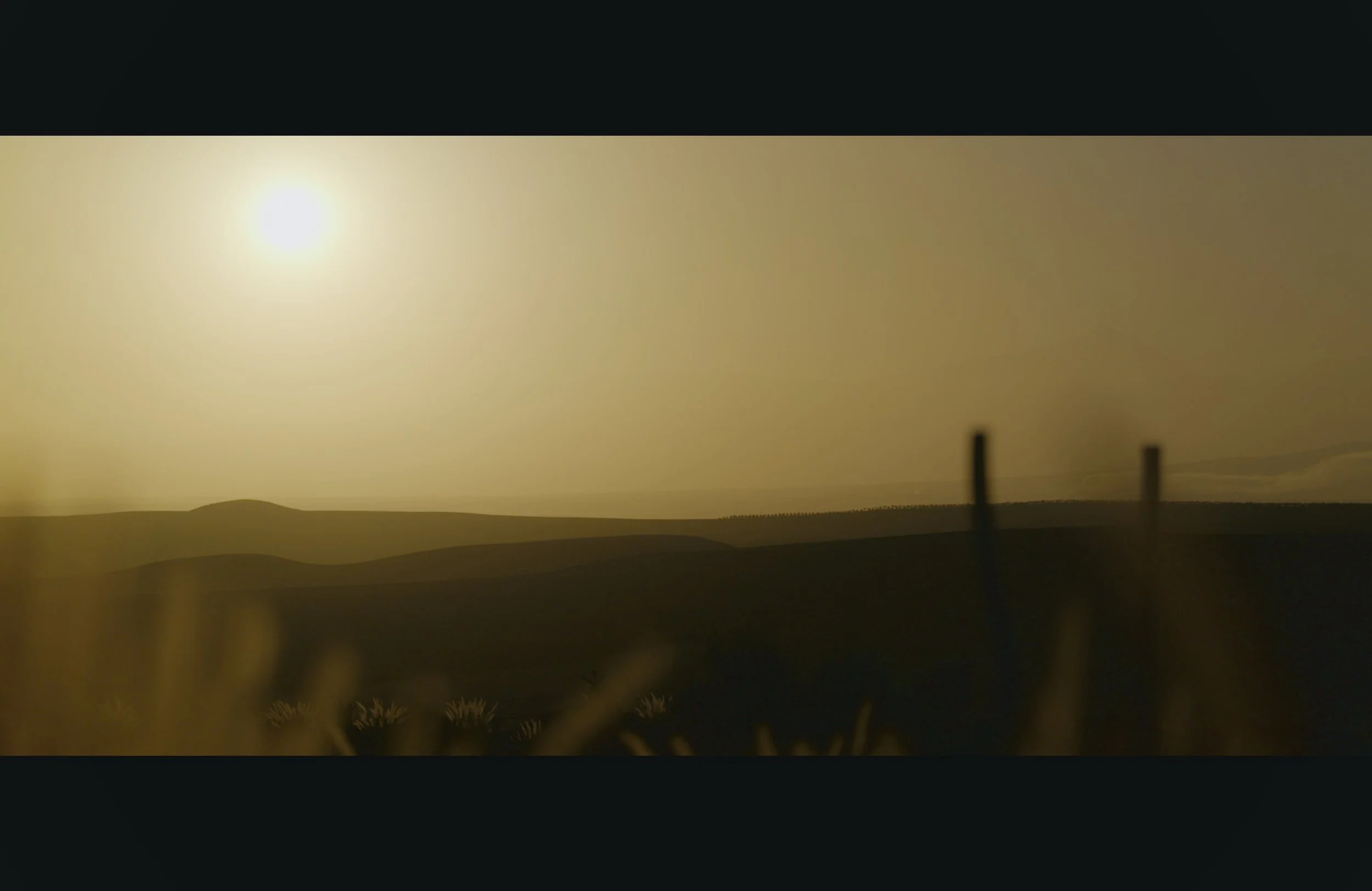 Nighttime scene with a bright moon in the sky, rolling hills in silhouette, and a few fence posts in the foreground.