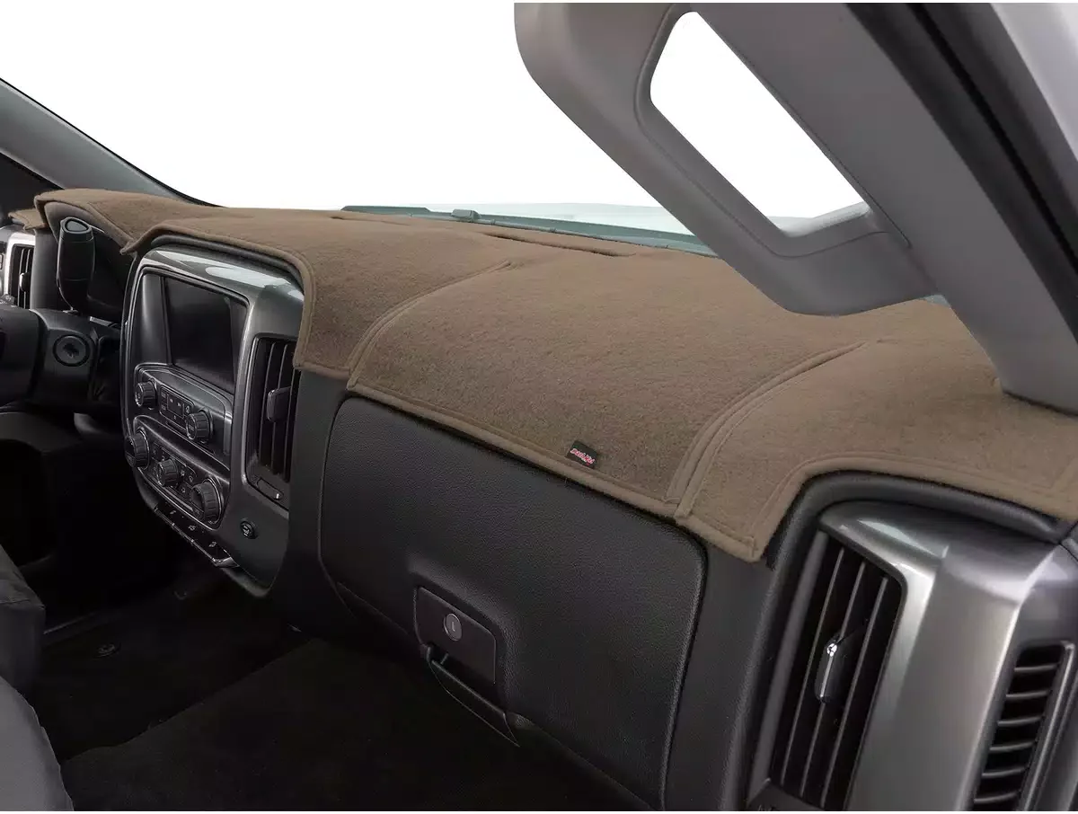 Interior of a vehicle dashboard with a tan fabric dash cover and air vents.