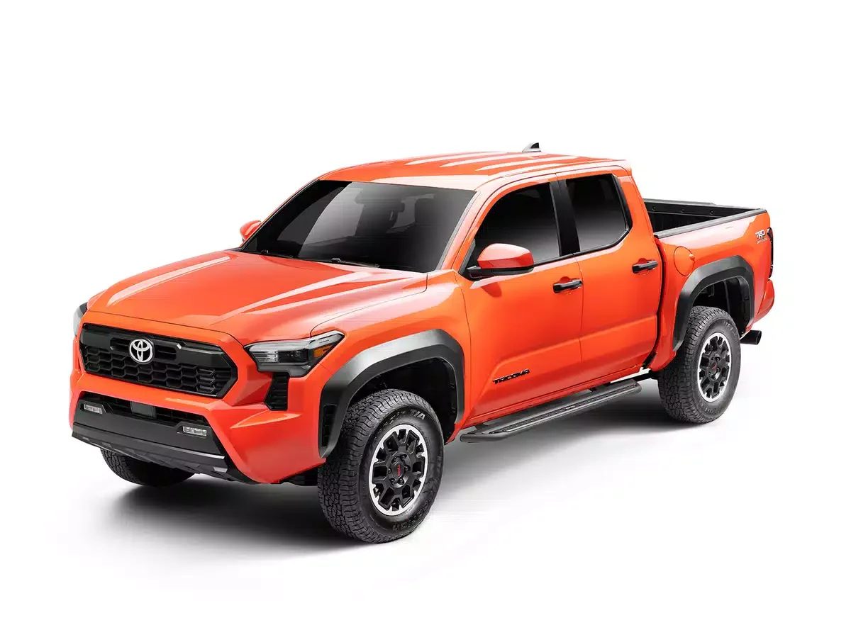 Orange Toyota pickup truck with black accents on a white background.
