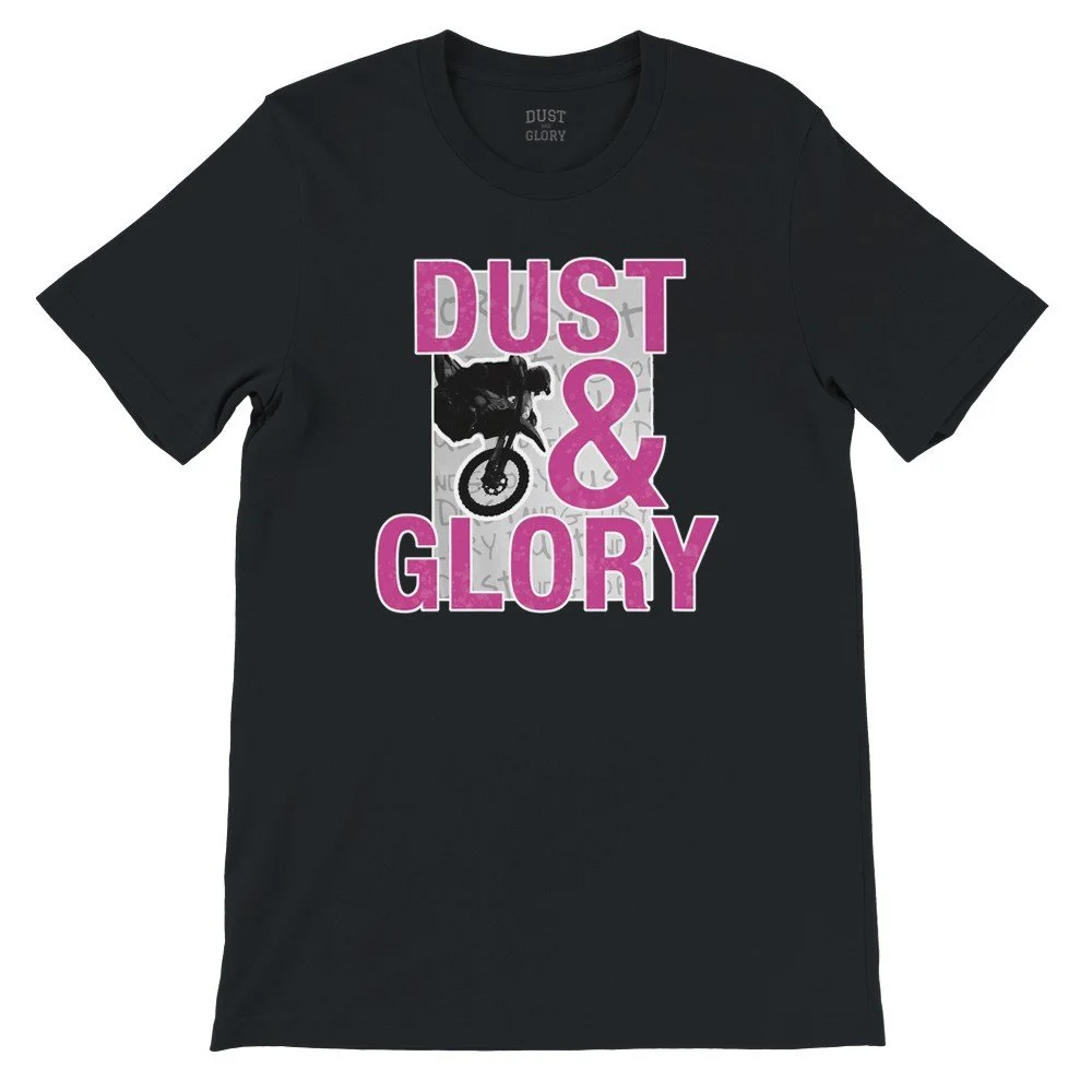Front of black Dust & Glory graphic t shirt with dirt bike rider jumping and bold pink lettering