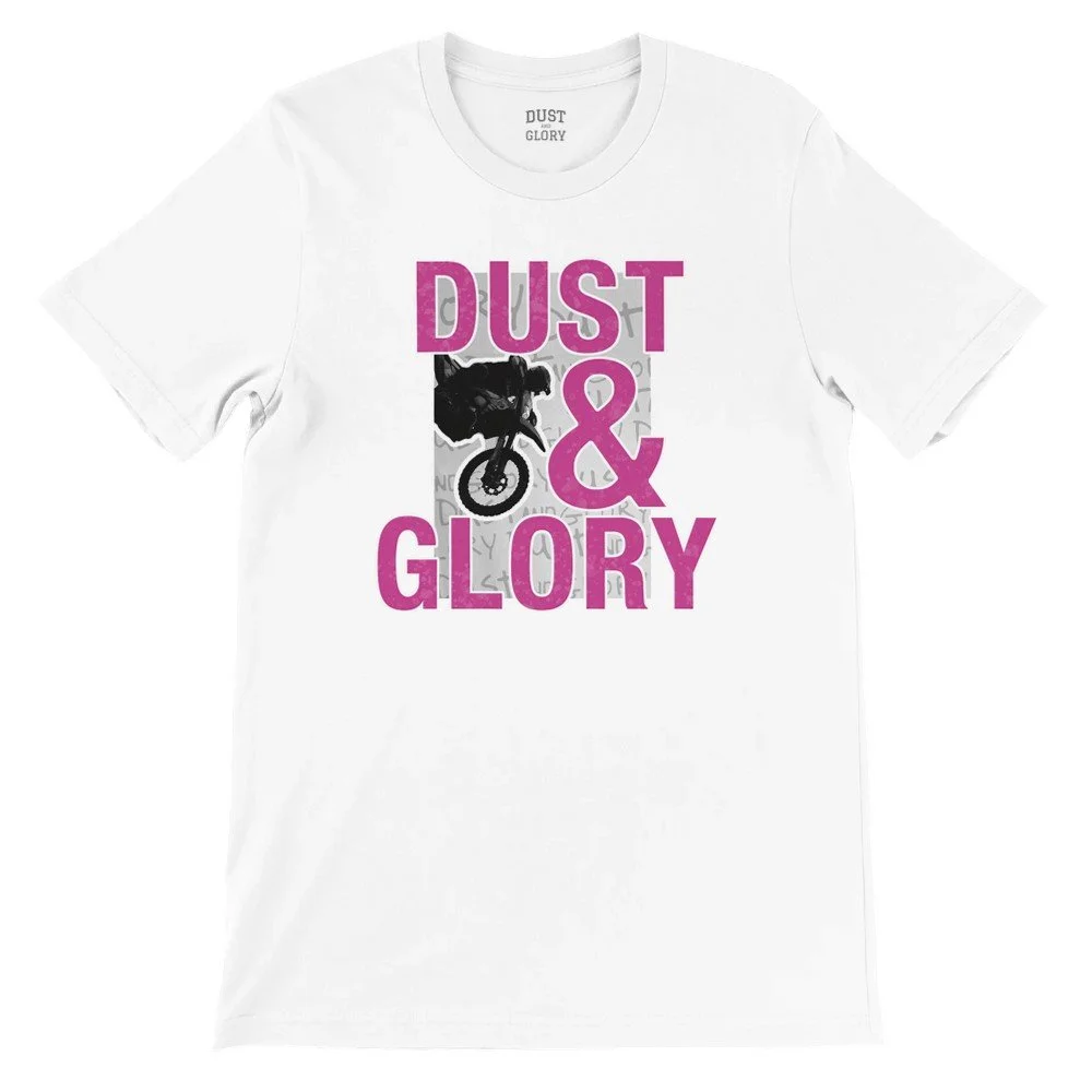 Front of black Dust & Glory graphic t shirt with dirt bike rider jumping and bold pink lettering
